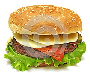 Hamburger with cheese, bacon, pickles, tomato, onions and lettuce isolated