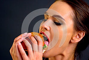 Hamburger eating contest. Woman eat with appetite .