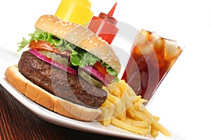 Hamburger fast food meal with fries and drink