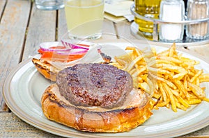 Hamburger with french fires at a restaurant