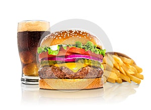 Hamburger fries and a coke soda pop cheeseburger combination deluxe fast food on white photo