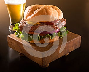 Hamburger on a kaiser bun with beer