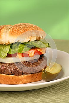 A hamburger with lettuce