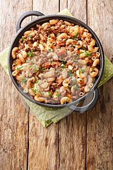 Hamburger and Macaroni closeup in the pan. Vertical top view