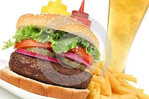 Hamburger meal with french fries and cold beer