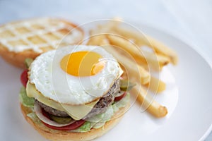Hamburger, meat, eggs with potatoes