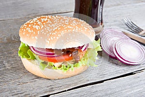 Hamburger with onion and drink