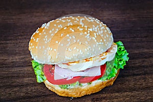 Hamburger on wooden floor closeup detail