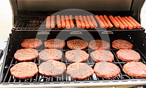 Hamburgers and Hot Dogs on Grill photo