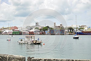 Hamilton, Bermuda - July 10, 2014: Hamilton Cargo Docks with stacked containers waterside.