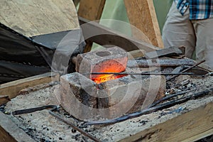 Hammer in the blacksmith`s forge close-up, heating up the metal