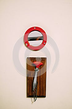 Hammer on the chain for breaking glass with fire alarm button