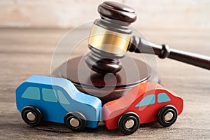 Hammer gavel judge with car vehicle accident, insurance coverage claim lawsuit court case