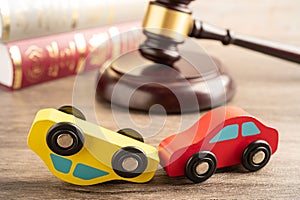 Hammer gavel judge with car vehicle accident, insurance coverage claim lawsuit court case