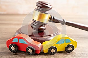 Hammer gavel judge with car vehicle accident, insurance coverage claim lawsuit court case