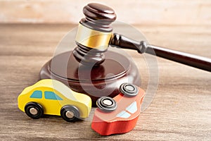 Hammer gavel judge with car vehicle accident, insurance coverage claim lawsuit court case