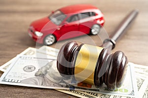 Hammer gavel judge and US dollar banknote money with car vehicle accident, insurance coverage claim lawsuit court case