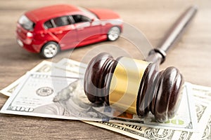 Hammer gavel judge and US dollar banknote money with car vehicle accident, insurance coverage claim lawsuit court case