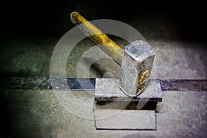 Hammer on iron anvil