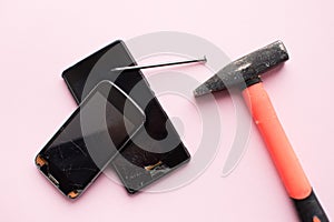 Hammer and mobile phone with broken display