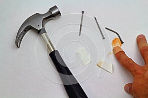 Hammer, nails and injured finger