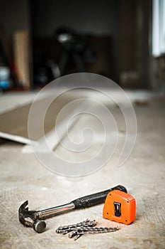 Hammer, Nails and Orange Measuring tape