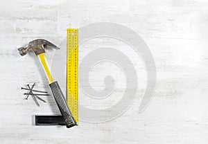 Hammer with nails, ruler. Construction tools.