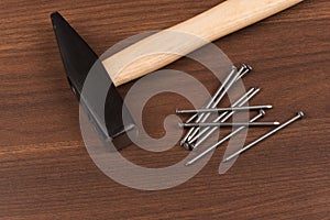 Hammer and nails on table