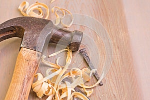 Hammer and nails on a wood board