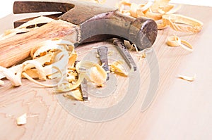 Hammer and nails on a wood board