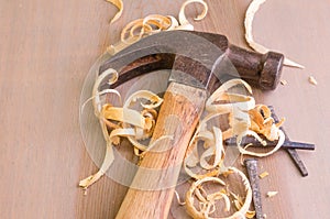 Hammer and nails on a wood board