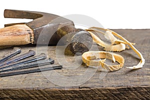 Hammer and nails on a wood board