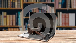 The hammer on notebook in Libraly Background for law concept 3d rendering