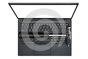 Hammer placed on laptop keyboard