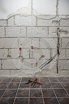 Hammer, pliers and water pump pliers on the ground at a construction site a symbol for construction freeze