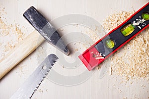 A hammer, a saw and a level