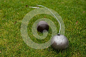 Hammer and shot put ball on the grass