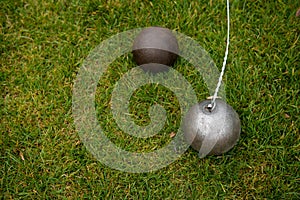 Hammer and shot put ball on the grass
