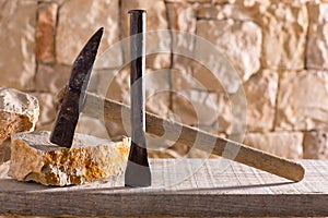 Hammer tools of stonecutter masonry work photo