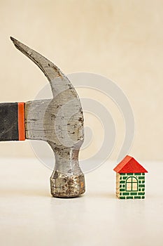 Hammer and toy house