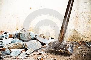 A hammer used to demolish the concrete tile floor and wall of the house before renovation. It heavy and very