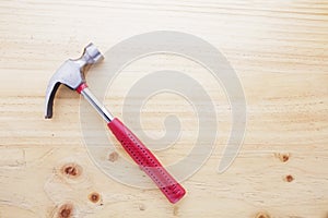 A hammer on a wood table