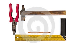 Hammer with wooden handle, pliers, square and pencil isolated on white background closeup