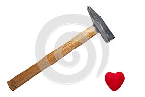 A Hammer with Wooden Handle Ready to Break, Crush Red Heart Isolated on White Background. Minimalist Healthcare, Heart attack risk