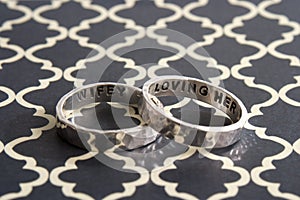 Hammered Rings on Black Design Background