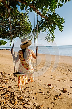 Hammock on the beach Krabi Thailand,woman in swing on Ao Nang beach Thailand Krabi