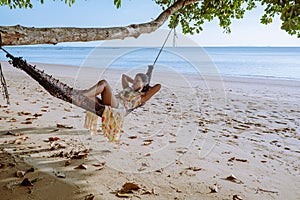 Hammock on the beach Krabi Thailand,woman in swing on Ao Nang beach Thailand Krabi