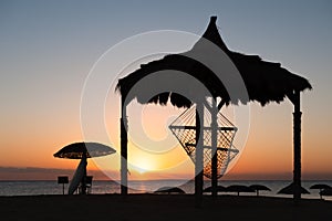 Hammock at the beach during sunset