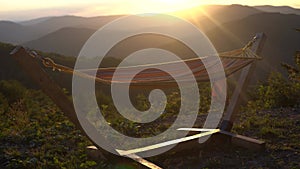 Hammock with a beautiful nature view of Mountains. Hanging hammock relaxing