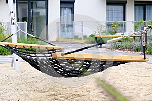 Hammock close-up on a playground in a cozy courtyard of modern residential district